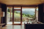 Cozy interior with a view of mountains through large windows
