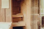 Interior of a wooden sauna with benches and wooden walls